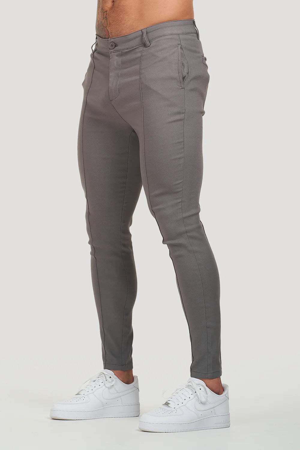 Milan Trousers in gray color, featuring a sleek tailored fit and durable fabric. Ideal for both casual and formal settings.