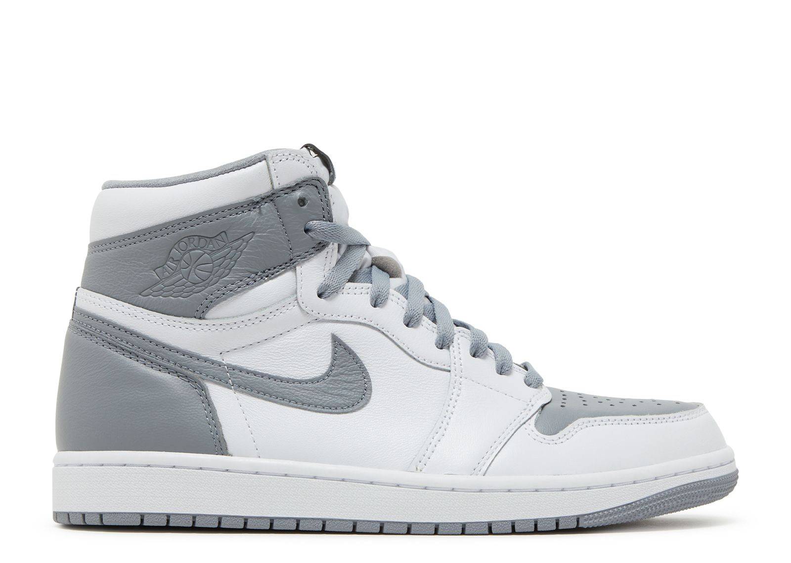 Air Jordan 1 Retro High OG Stealth leather sneakers featuring a white leather base with grey accents, high-top design, and Air-sole cushioning.