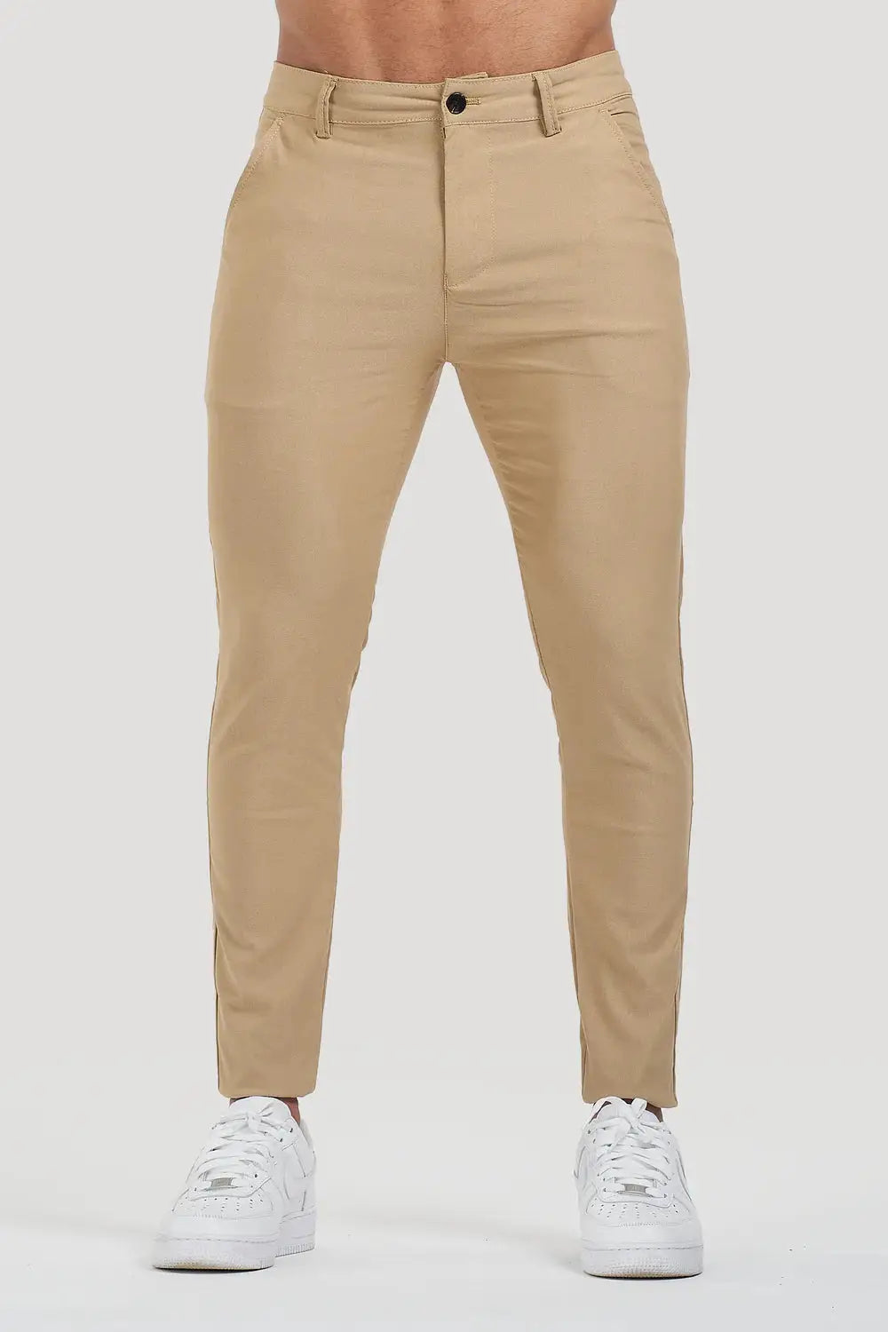 Front view of Avari Trousers Cream slim fit, showcasing the clean and minimalist design ideal for versatile styling.