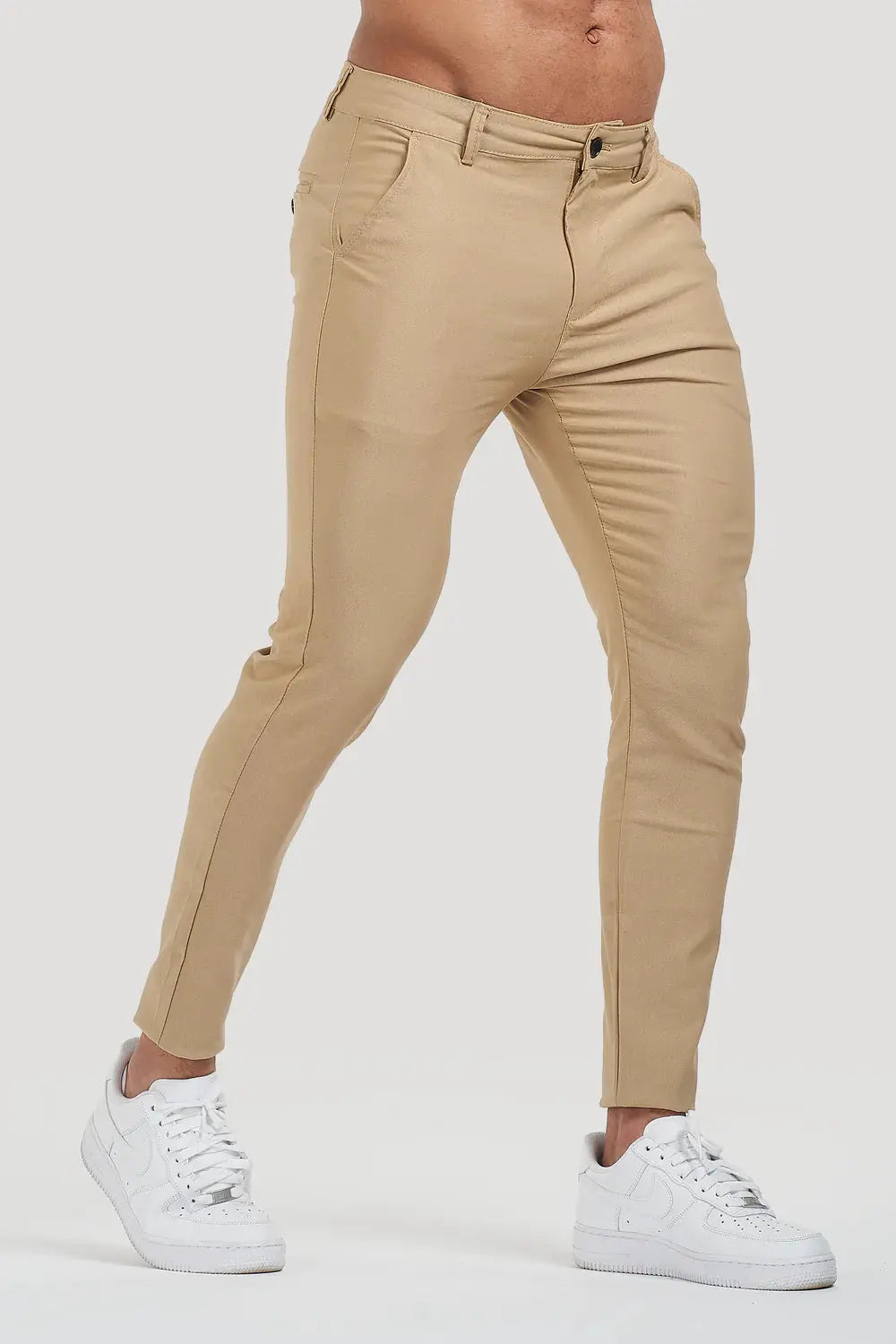 Avari Trousers Cream slim fit with a close-up of the tapered leg design, perfect for a sleek and modern outfit.