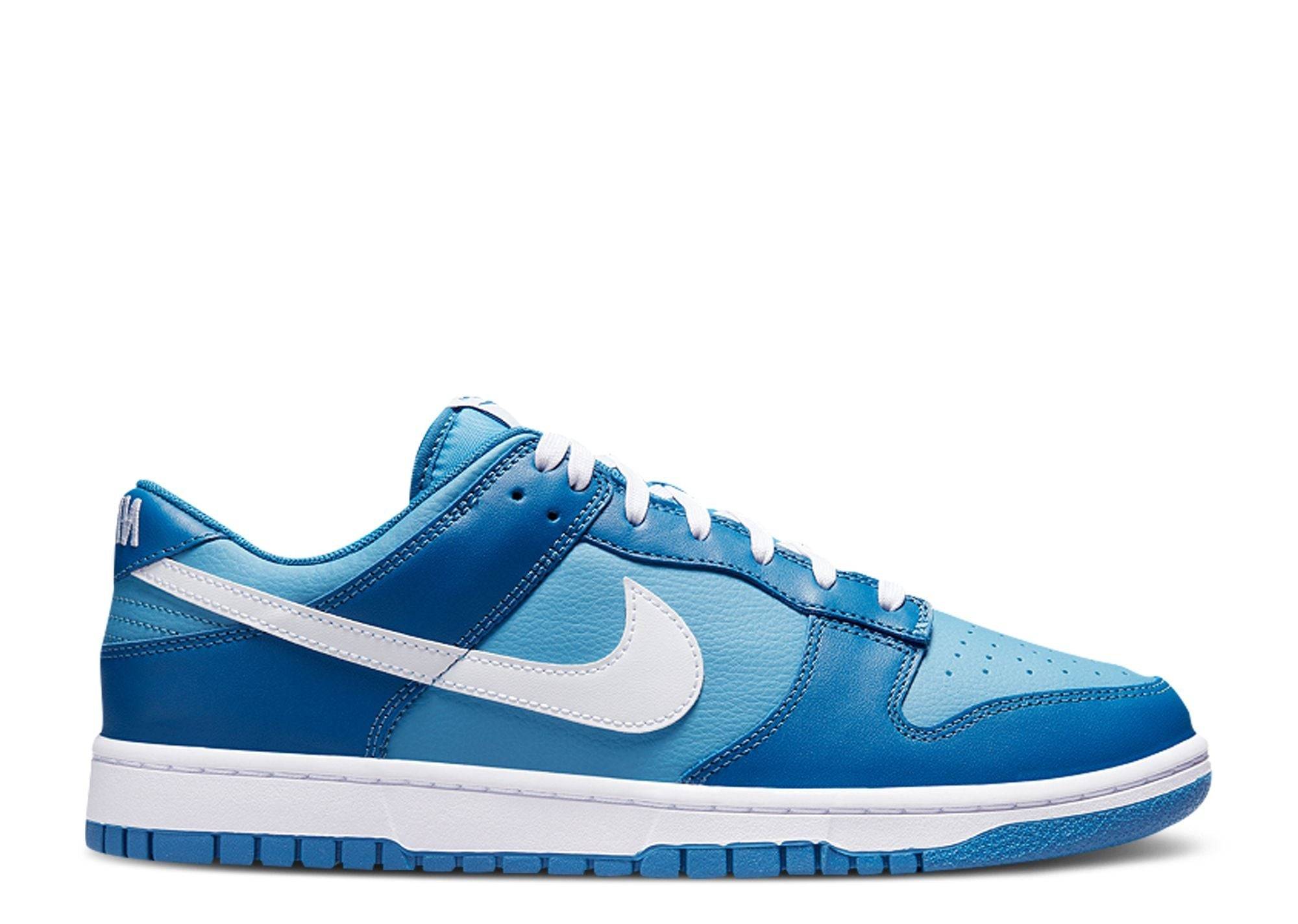 Dunk Low GS Dark Marina Blue sneaker featuring a bright blue sole, pebbled leather upper, and white Nike swoosh. Stylish design for casual wear.