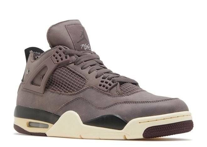 Side angle of A Ma Maniere Air Jordan 4 Retro Violet Ore sneaker showcasing luxury purple nubuck, mesh detailing, and cream midsole.