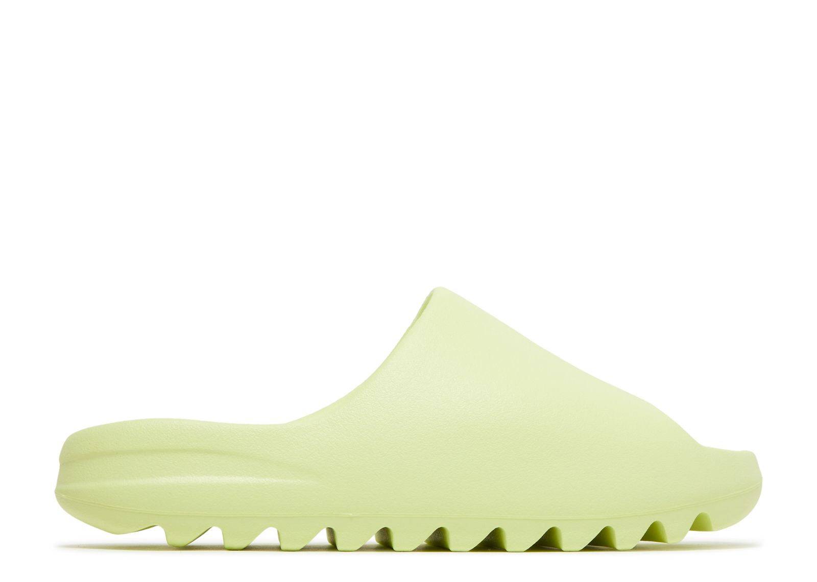 Yeezy Slide Glow Green 2022 sneaker featuring vibrant glow green EVA foam, lightweight design, and grooved outsole for traction.