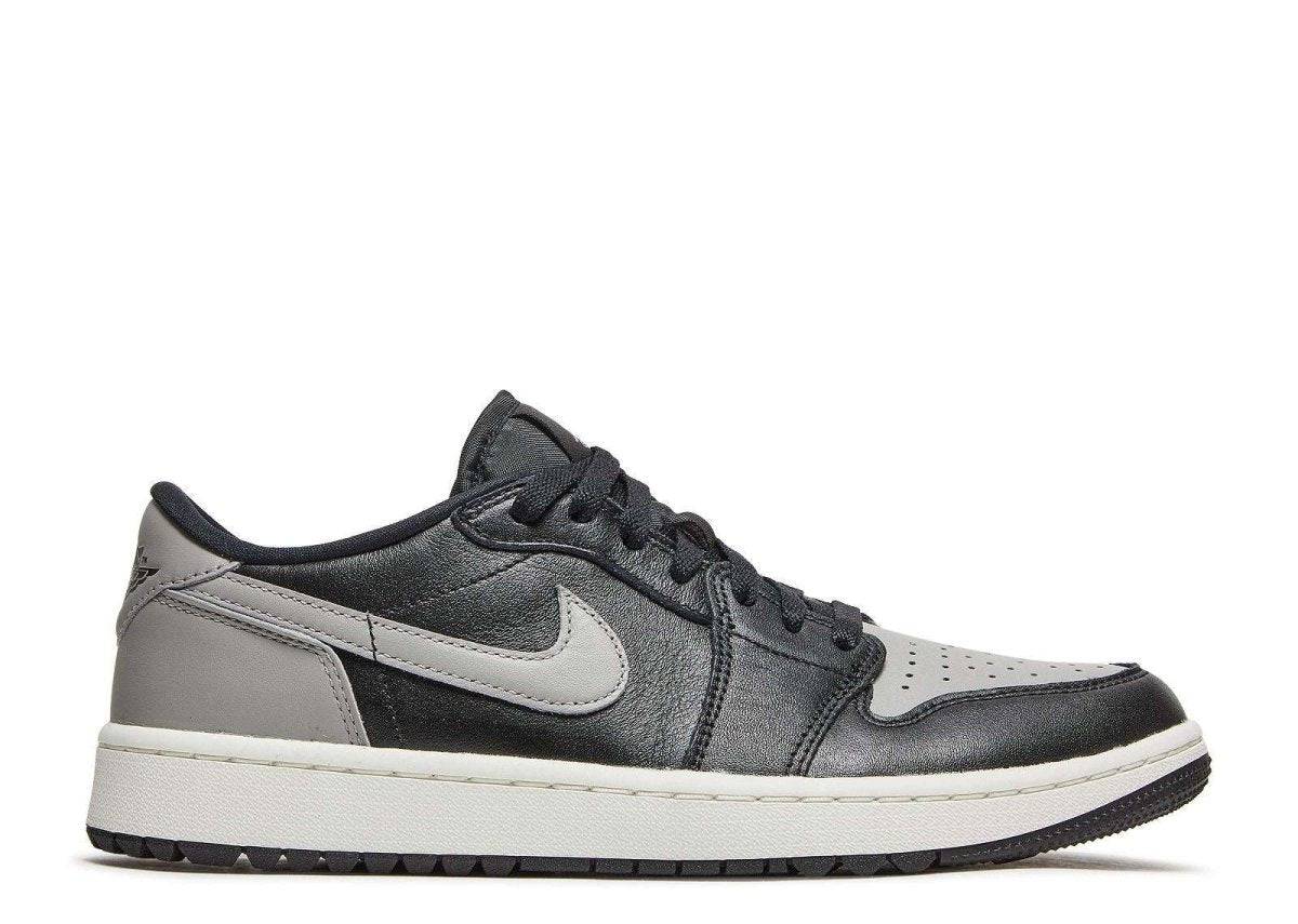 Air Jordan 1 Low Golf Shadow sneaker featuring a sleek black and gray leather upper, white midsole, and traction outsole for golf performance.