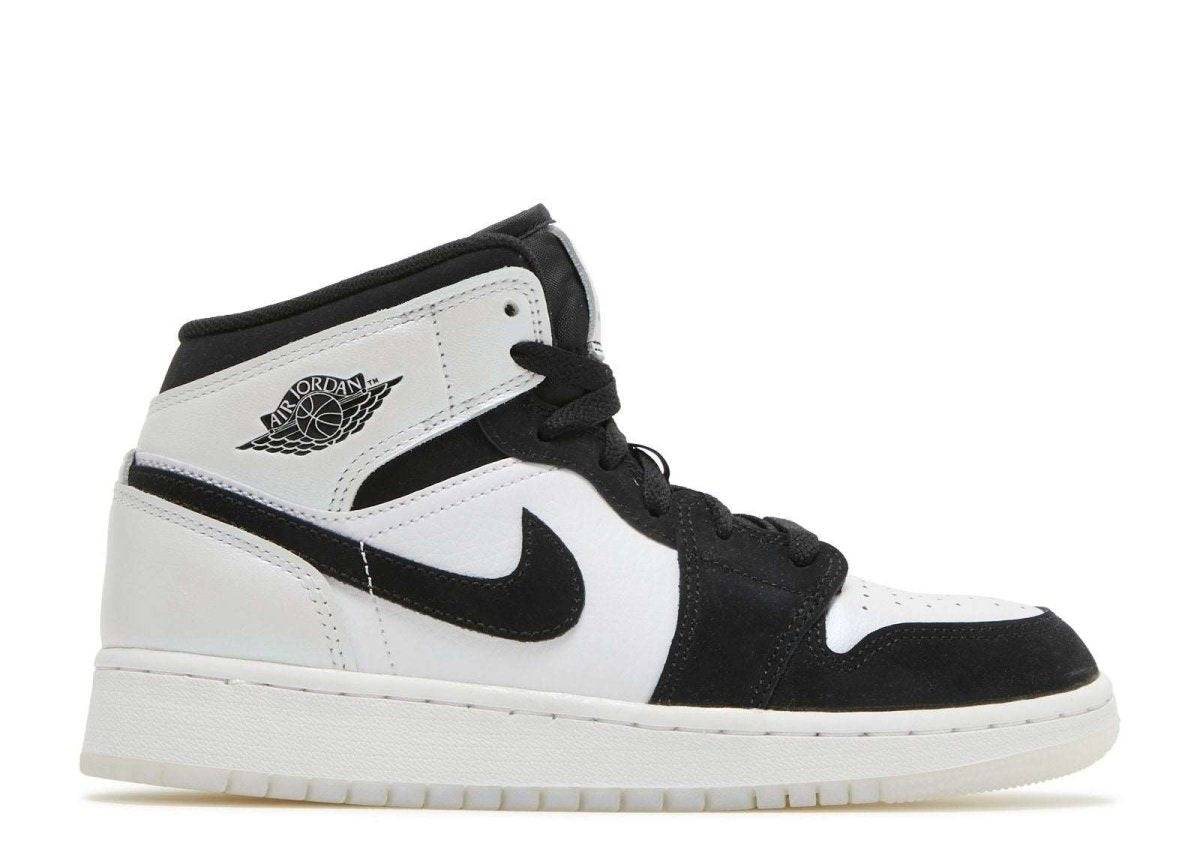 Air Jordan 1 Mid SE GS Diamond sneaker featuring a white leather upper with black suede overlays, Nike Swooshes, and wings logo.