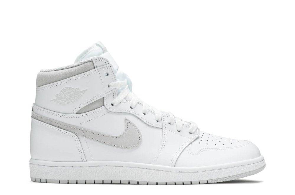 Air Jordan 1 Retro High 85 OG Neutral Grey sneaker showcasing a vintage-inspired design with white leather upper, Neutral Grey suede Swoosh, and classic 'Wings' logo.