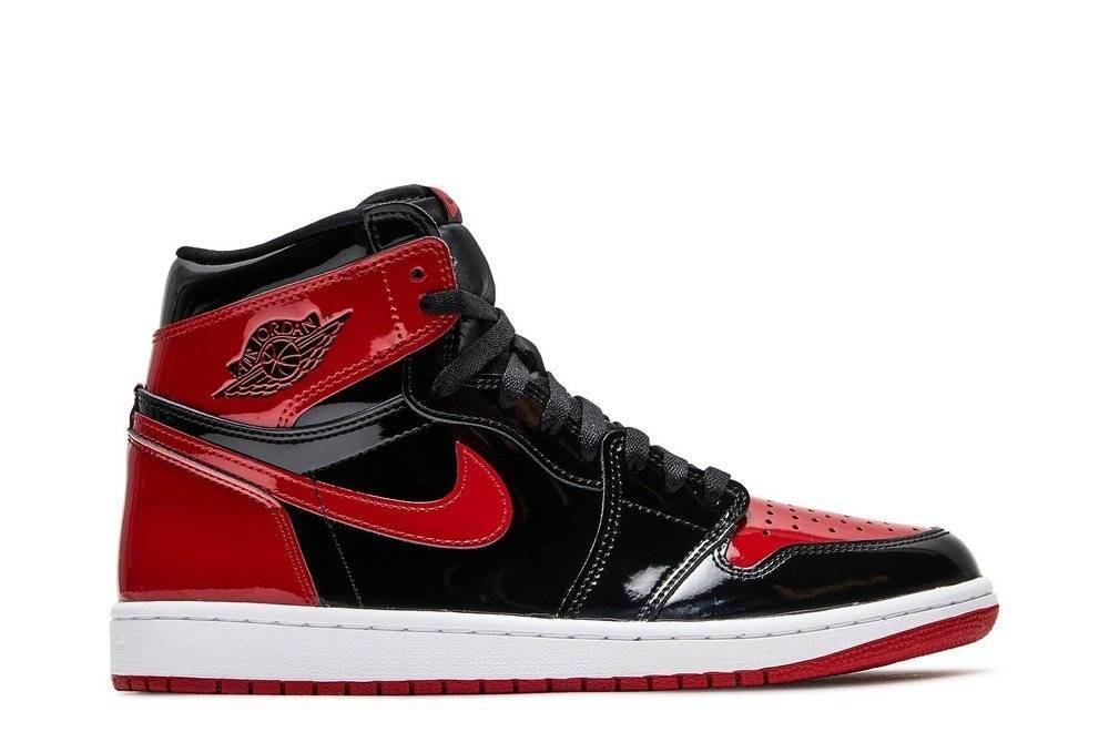 Air Jordan 1 Retro High Bred sneakers in black and red patent leather with Nike Air tongue labels and Wings logo. Released December 2021.