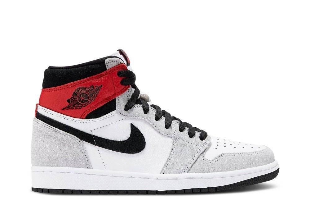 Air Jordan 1 Retro High OG Smoke Grey sneaker featuring a white leather upper, grey suede overlays, black Nike Swoosh, and red accents. Iconic design for casual and athletic wear.