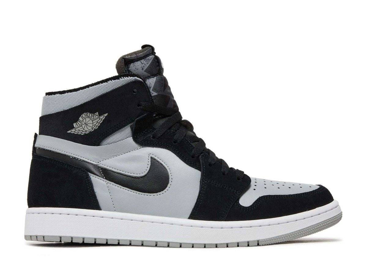 Air Jordan 1 Zoom CMFT Black Light Smoke Grey sneaker featuring a black and light grey colorway, Zoom Air cushioning, and durable rubber sole for comfort and style.