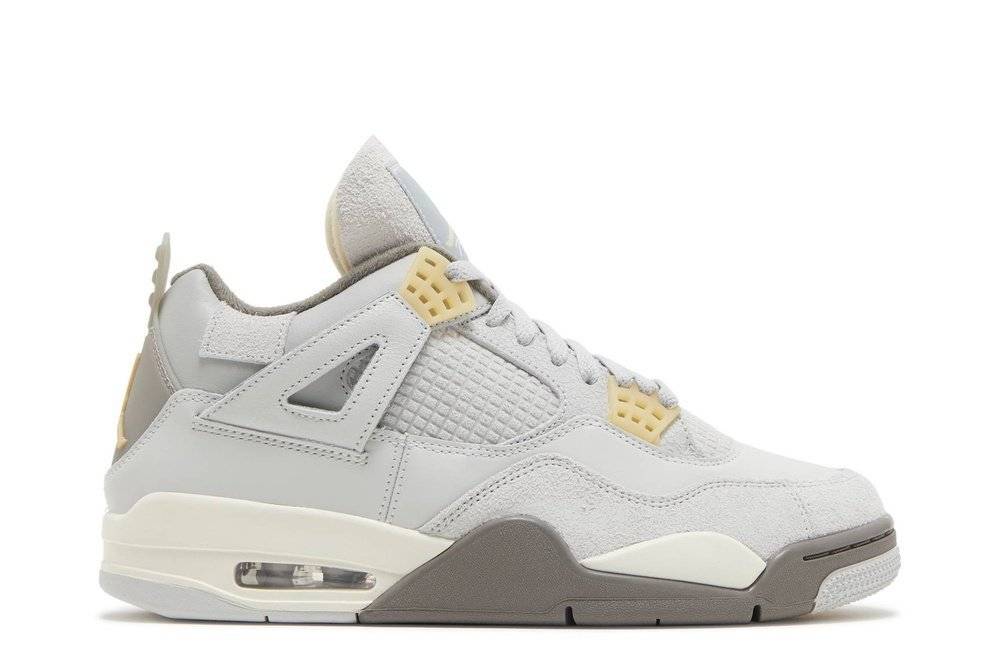 Air Jordan 4 Craft Photon Dust sneaker featuring grey leather and suede upper, suede cage, cracked leather wing, and yellow accents.