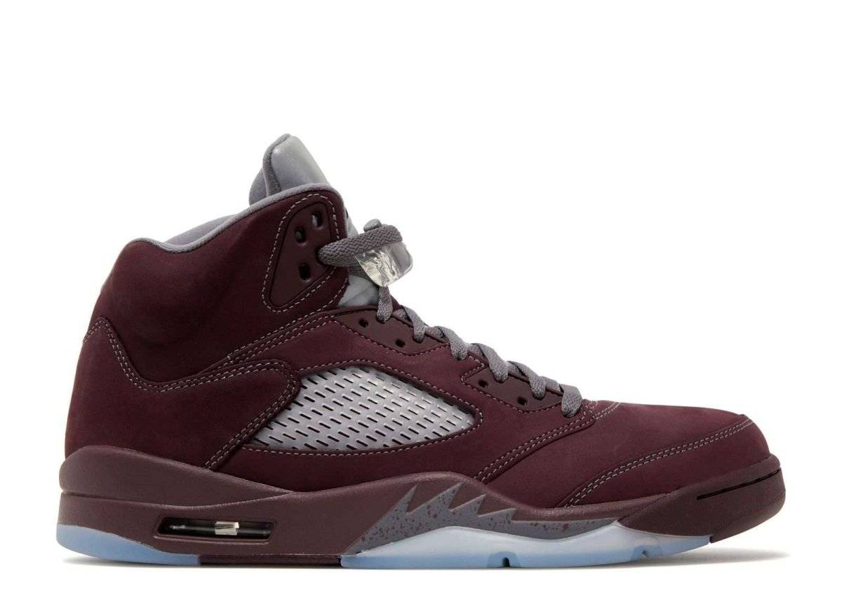 Air Jordan 5 Retro Burgundy 2023 sneaker featuring a burgundy suede upper, reflective tongue accents, and a visible Air-Sole unit.