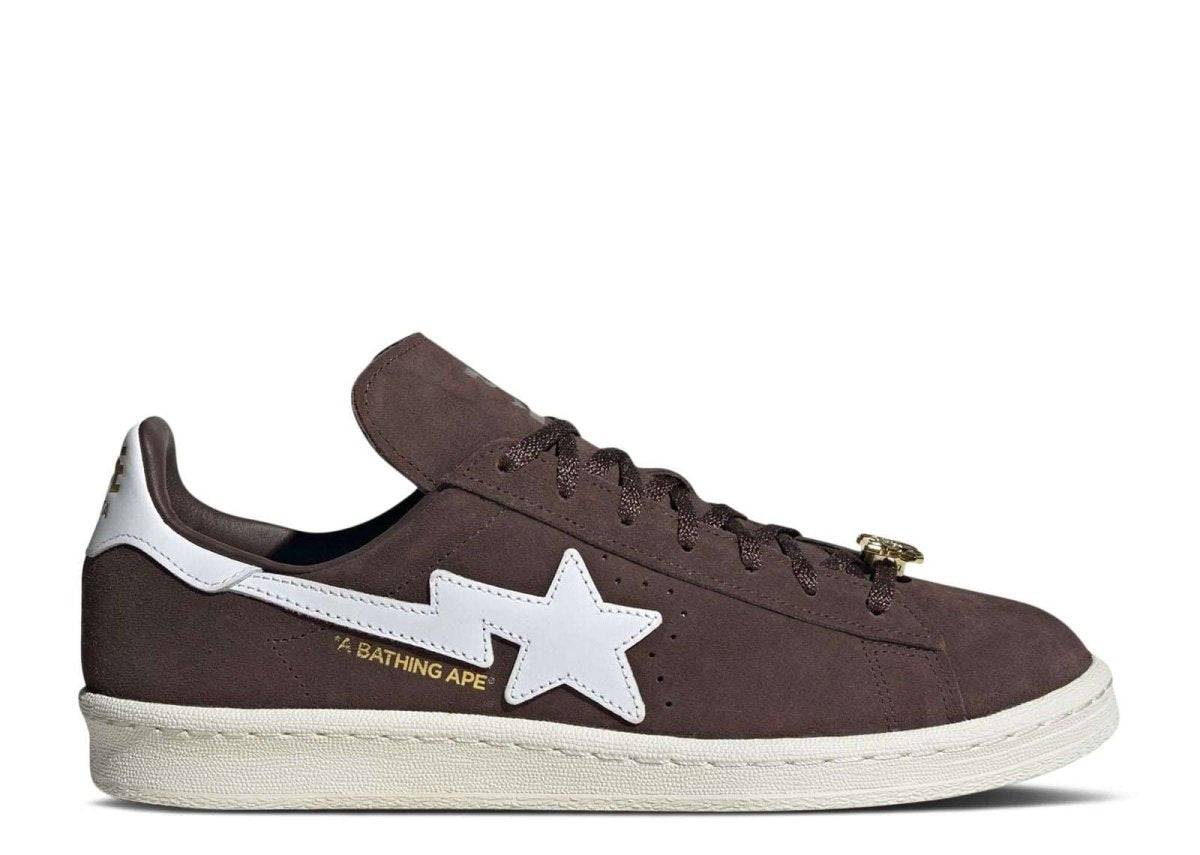 BAPE x Campus 80s Sneakers in brown suede with white star detailing, dual branding, and gold anniversary accents. Celebrates Bape's 30th Anniversary.