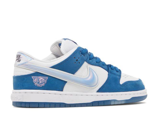 Opposite side of Born x Raised Dunk Low SB sneaker with blue and white colorway, silver accents, and embroidered branding.