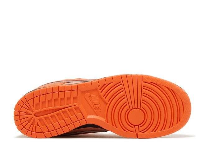 Outsole of the Nike SB Dunk Low Orange Lobster sneaker in bright orange rubber, highlighting its durable and stylish design.