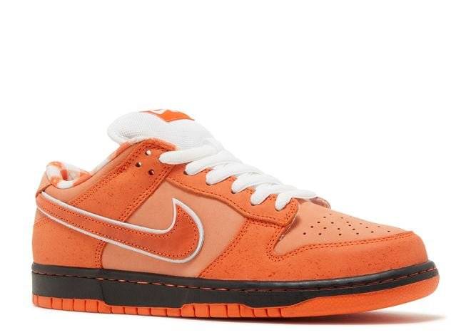 Nike SB Dunk Low Orange Lobster sneaker showcasing orange tones, speckled overlays, white accents, and a black midsole with orange outsole.