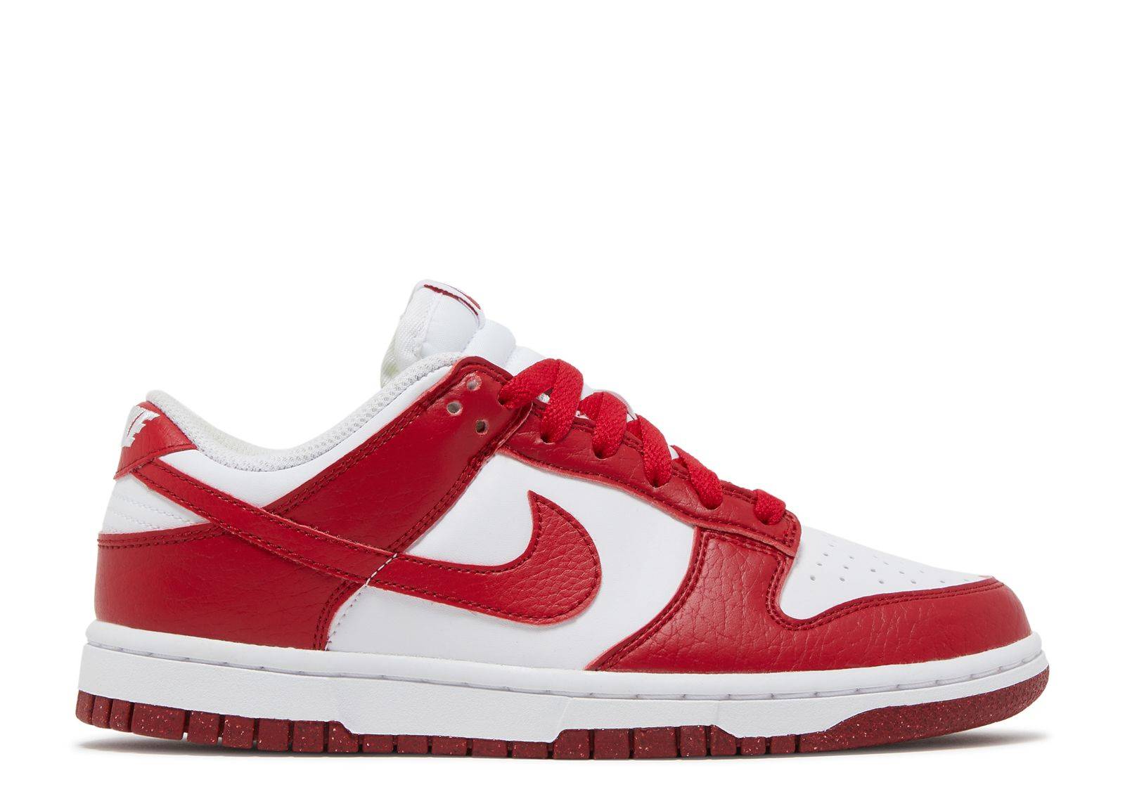 Wmns Dunk Low Gym Red - Nike Dunk Low with Flyleather upper, white base, and Gym Red overlays. Eco-friendly sneaker released in May 2022.