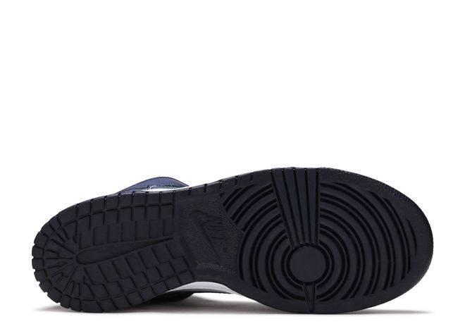 Outsole view of Nike Dunk High GS Midnight Navy sneaker with black rubber sole and circular traction pattern for grip.