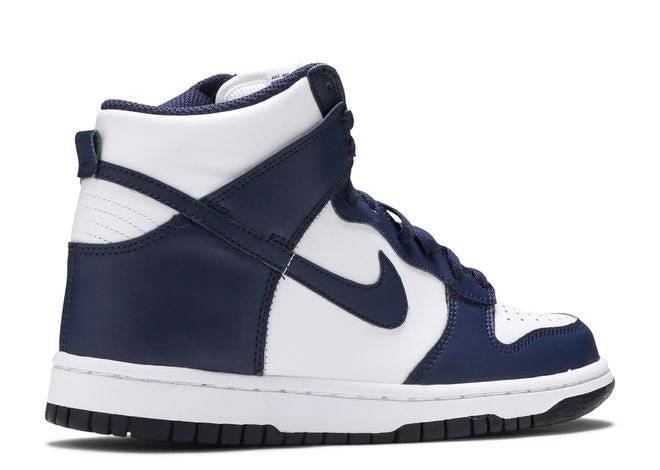 Nike Dunk High GS Midnight Navy sneaker showcasing the medial side with navy overlays and white leather panels for a sleek look.