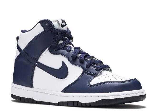 Side view of Nike Dunk High GS Midnight Navy sneaker featuring white leather base, navy accents, and durable rubber sole.