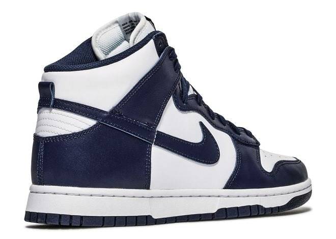 Rear angle of Nike Dunk High Midnight Navy sneaker highlighting navy leather heel panel and white midsole design.