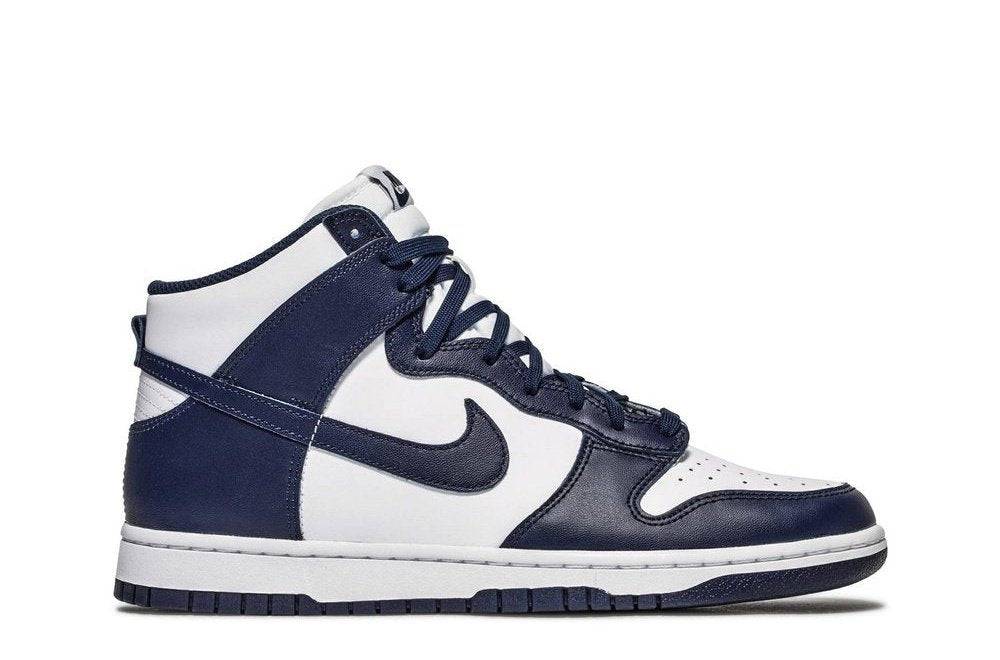 Nike Dunk High Midnight Navy sneaker featuring white leather upper with navy overlays and Swoosh, styled for casual wear.