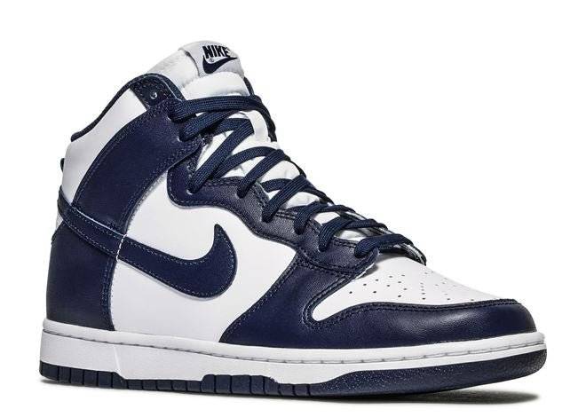 Side view of Nike Dunk High Midnight Navy sneaker showcasing navy leather overlays, white leather base, and matching laces.