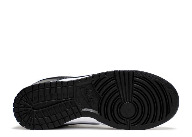 Nike Dunk Low Black White sneaker outsole view showing the durable black rubber sole with traction pattern and Nike branding.