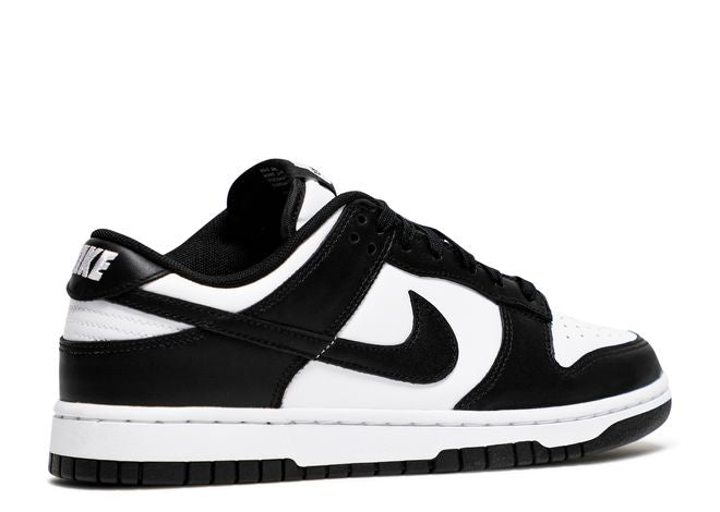 Nike Dunk Low Black White sneaker side view displaying the clean leather construction, black Swoosh, and low-top silhouette.