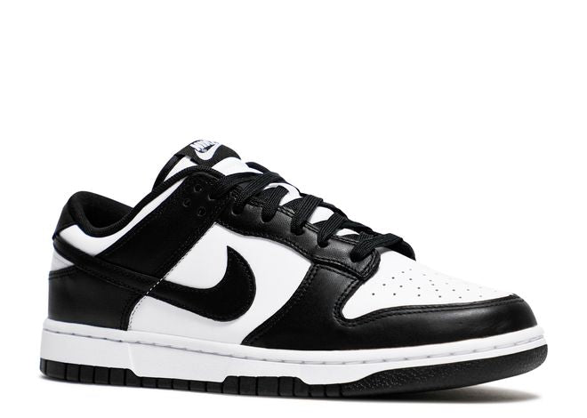 Nike Dunk Low Black White sneaker angled view highlighting the black and white color-blocking, perforated toe box, and branding details.