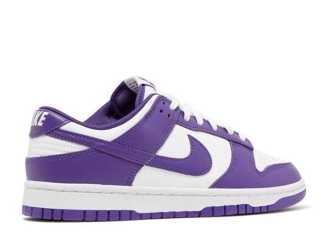 Rear angle of Nike Dunk Low Championship Purple sneaker highlighting purple heel tab with Nike branding and white leather details.