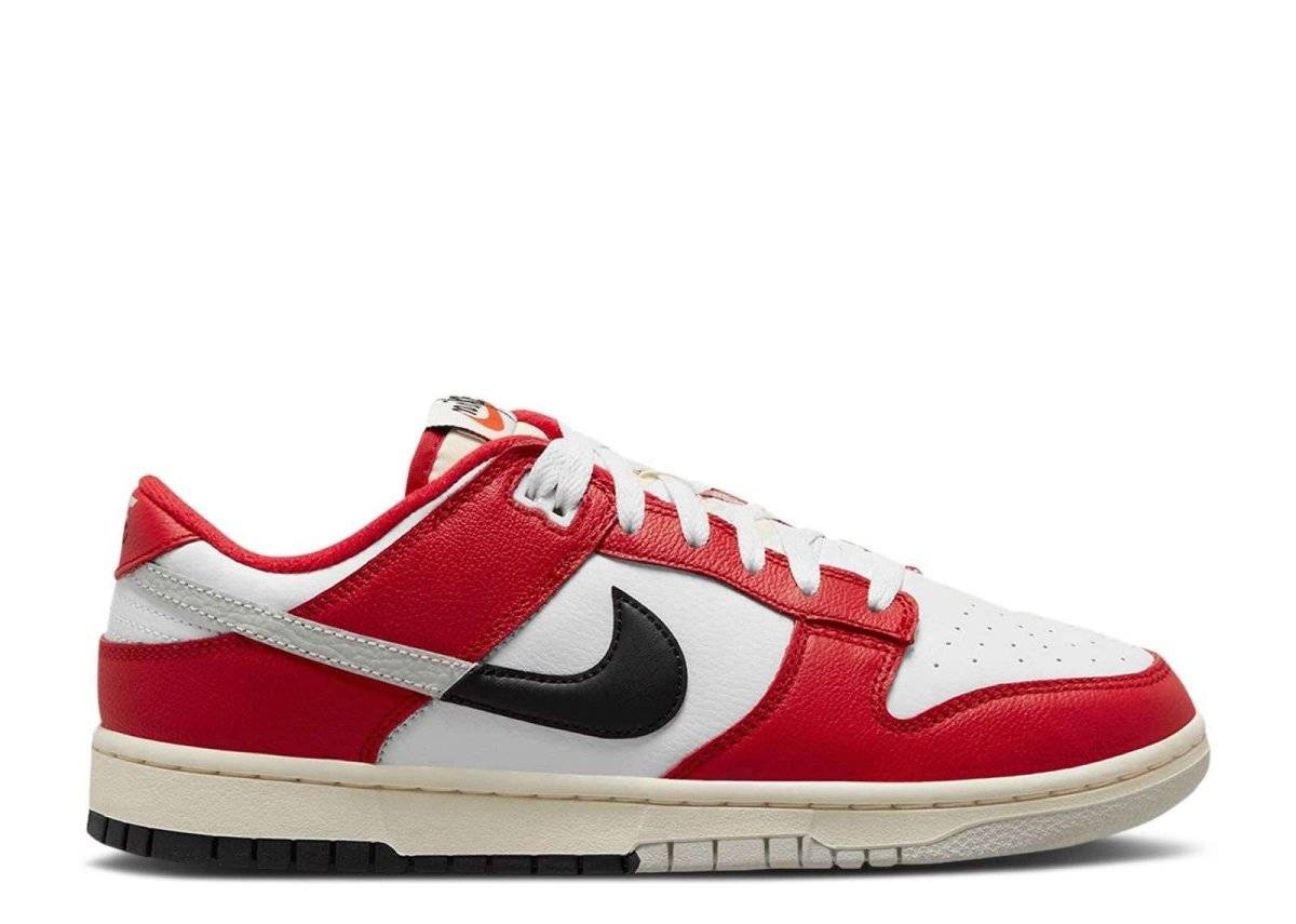 Nike Dunk Low Chicago Split sneaker featuring a bold split colorway of University Red, Black, Light Silver, and White. Released July 14, 2023, with a unique Swoosh design.