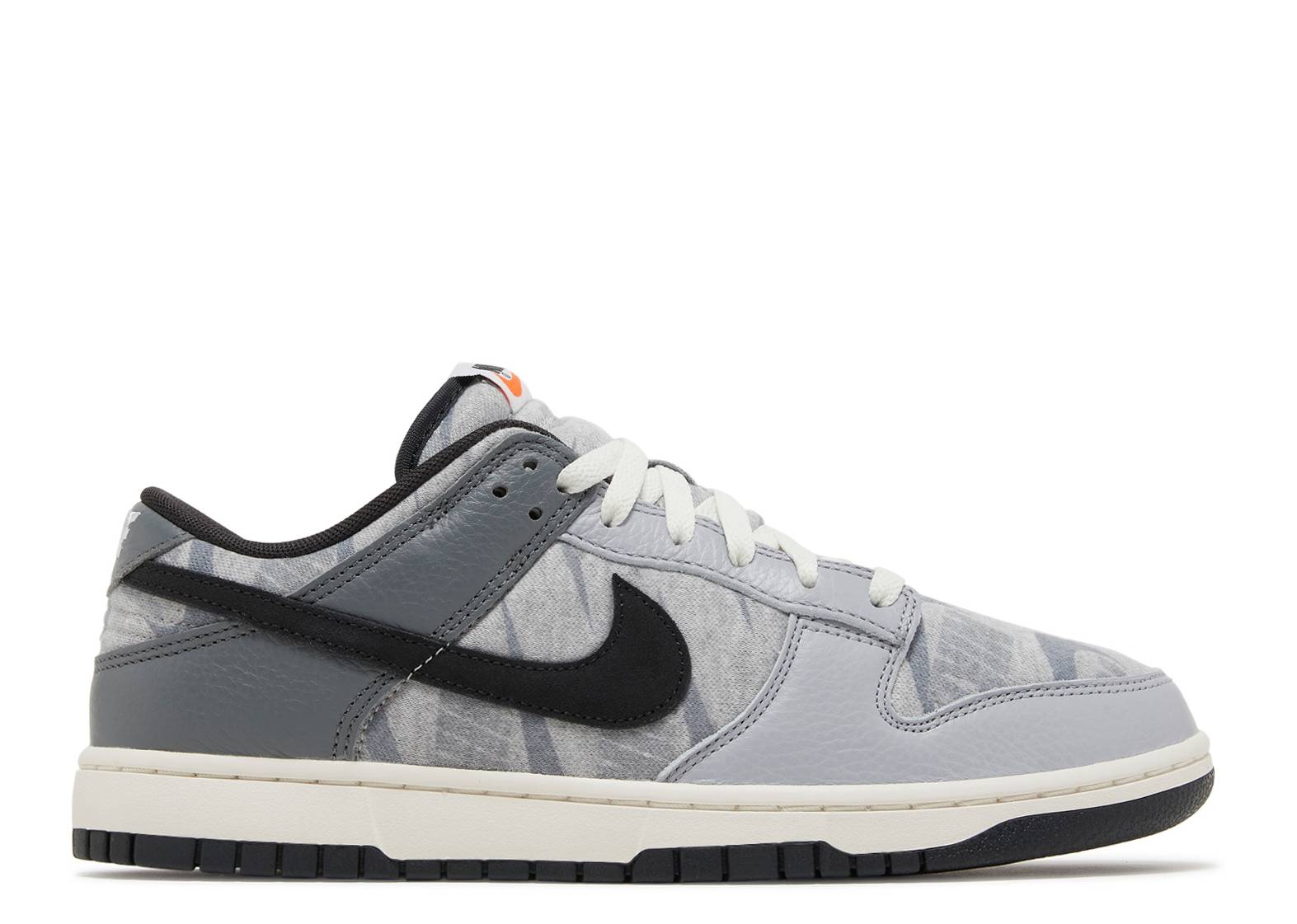 Nike Dunk Low SE Copy Paste sneaker featuring gray mesh upper, black Nike swoosh, white laces, and a cream sole. Released May 1, 2022.