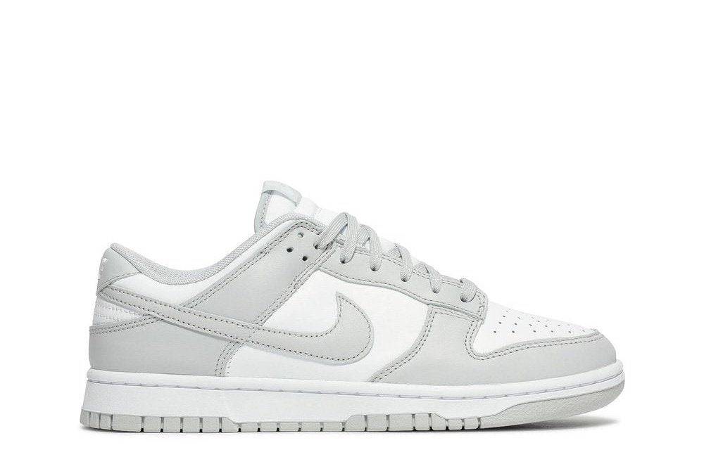 Nike Dunk Low Grey Fog sneaker featuring a white leather upper with Grey Fog overlays and swooshes, side profile view.