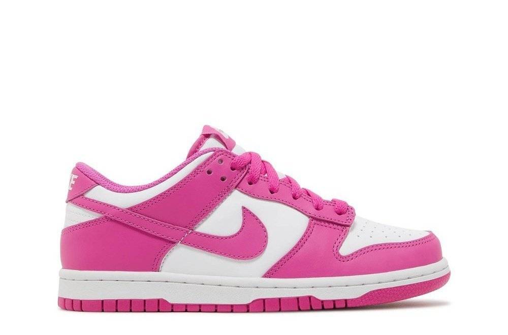 Nike Dunk Low GS Active Fuchsia sneakers featuring a low-profile design with a white leather upper and vibrant fuchsia overlays. Perfect for casual wear, available in youth sizes.