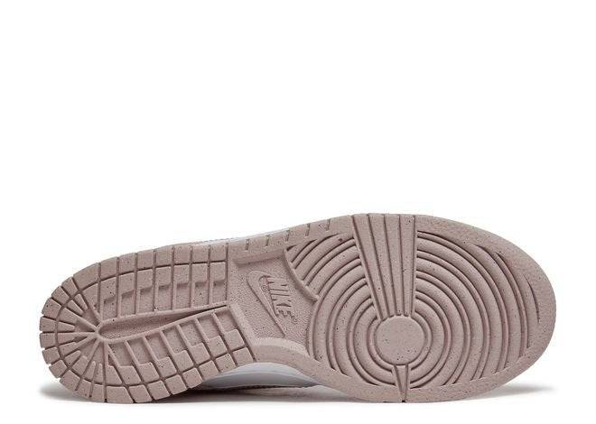 Nike Dunk Low GS Pink Velvet sneaker outsole in semi-translucent pink rubber with detailed traction pattern.