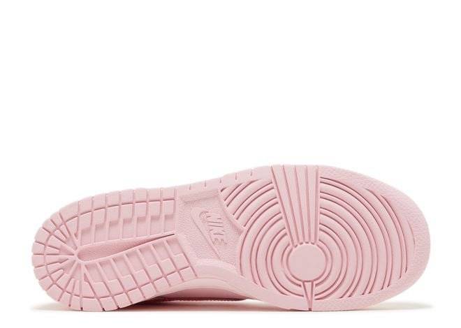 Nike Dunk Low GS Triple Pink sneaker outsole in light pink rubber, featuring durable traction pattern for comfort and performance.