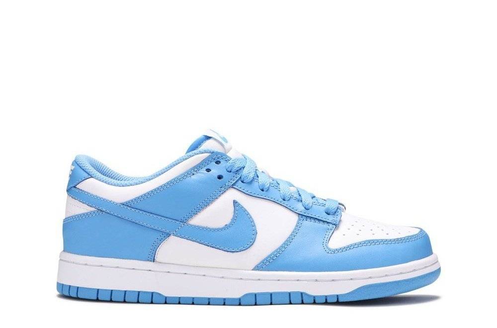 Dunk Low GS University Blue sneaker featuring a white leather base with vibrant University Blue overlays, Nike Swoosh, and a low-profile design.