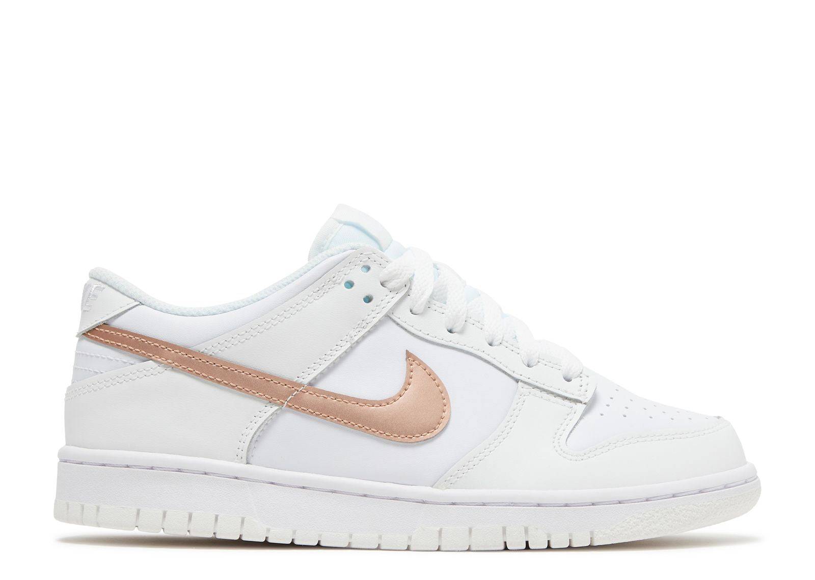 Nike Dunk Low GS in white with metallic red bronze accents, featuring a leather upper, signature Swoosh, panelled design, and rubber sole. Ideal for sneaker enthusiasts.