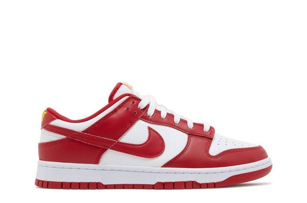 Nike Dunk Low Gym Red women's sneaker featuring white Flyleather base, Gym Red overlays, and signature Swooshes. Released May 2022.