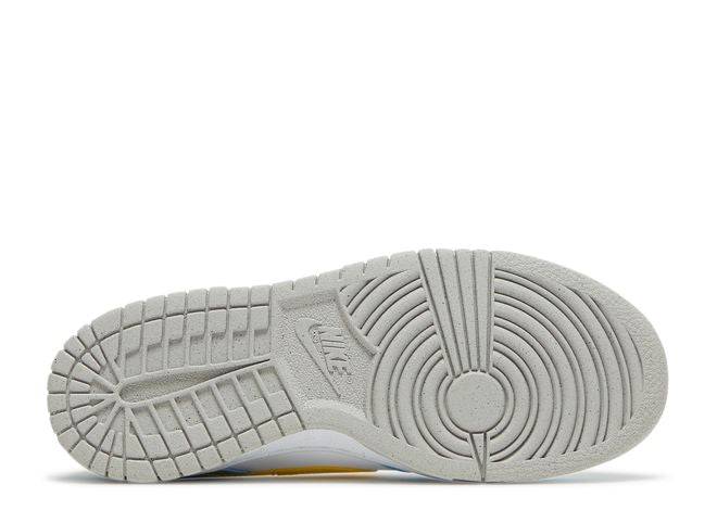 Outsole view of the Nike Dunk Low Next Nature GS Homer sneaker displaying its durable gray rubber sole with circular traction pattern.