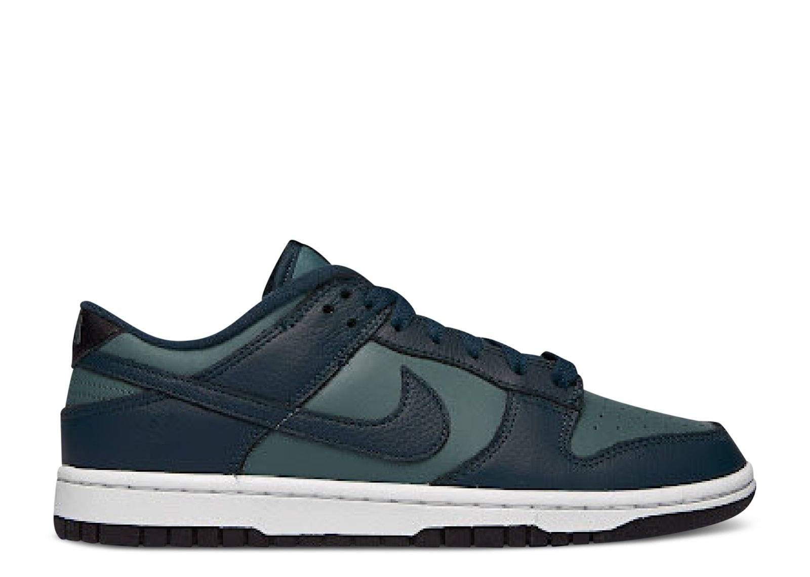 Dunk Low Premium Armory Navy sneaker featuring a dark navy leather upper, tonal Swoosh, white midsole, and black outsole. Classic Nike design with premium materials.