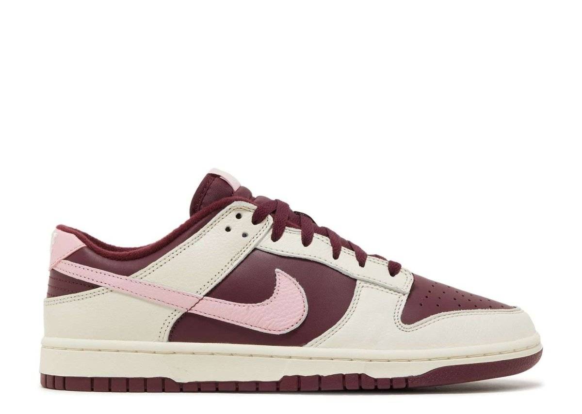 Nike Dunk Low Premium Valentine's Day sneaker featuring burgundy and sail leather with a tumbled pink Swoosh, burgundy outsole, and mesh sockliner.