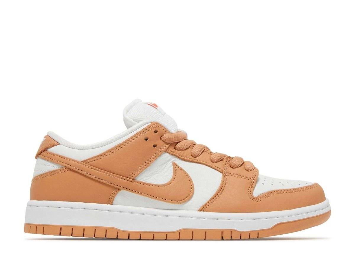 Nike SB Dunk Low Light Cognac sneaker featuring an orange-pink and white leather upper, low-top design, and white laces. Orange Label edition released in May 2022.