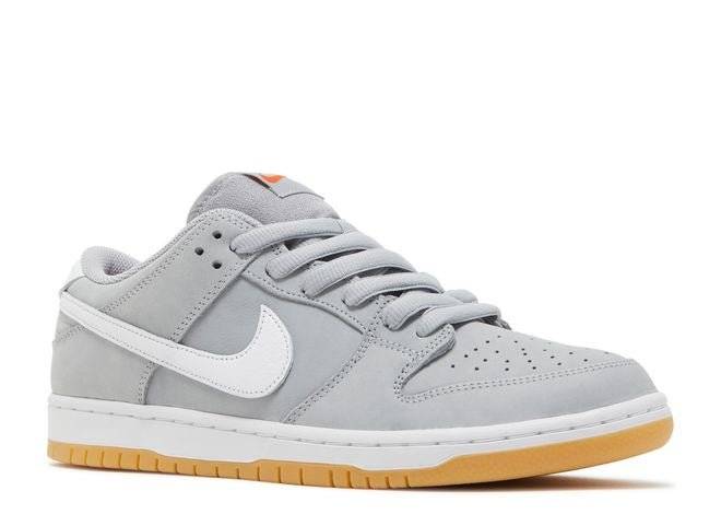 Side view of the Nike SB Dunk Low Pro ISO Wolf Grey Gum sneaker featuring a grey suede upper, white Swoosh, and gum rubber outsole.