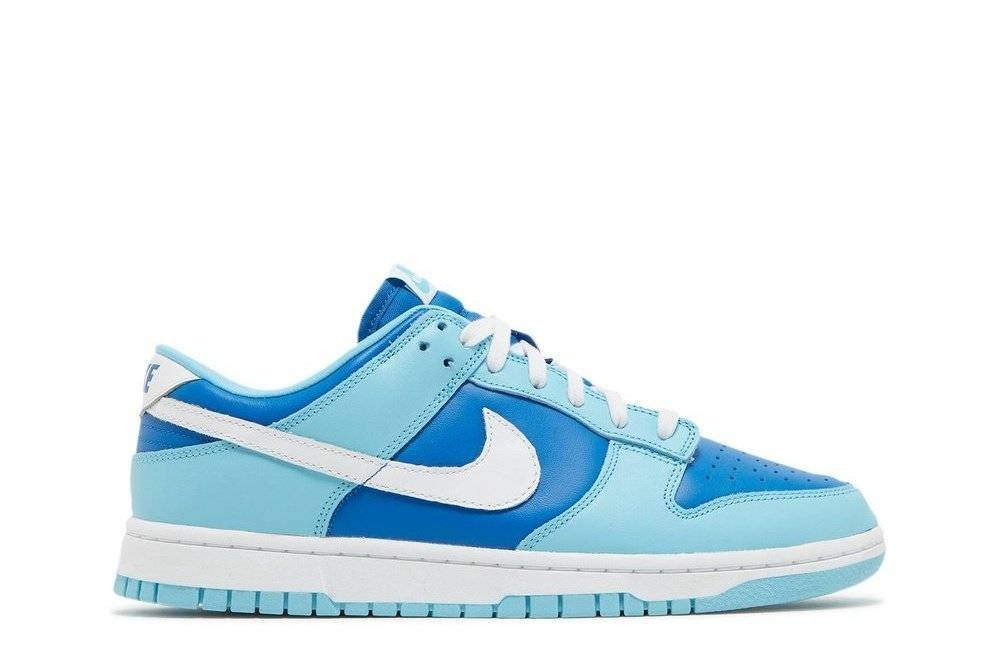 Nike Dunk Low Retro QS Argon 2022 sneaker with marine blue and powder blue leather upper, white Swoosh, and rubber cupsole, side view.