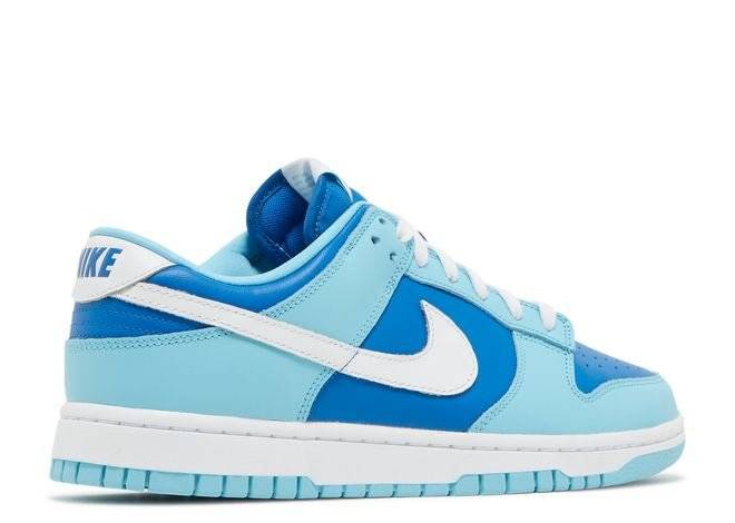 Nike Dunk Low Retro QS Argon 2022 sneaker featuring marine blue and powder blue leather upper, white Swoosh, and padded collar, rear side view.