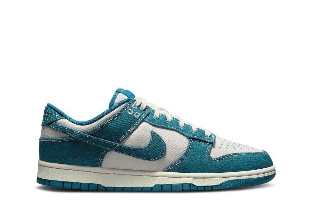 Nike Dunk Low Industrial Blue sneaker featuring a leather and nubuck construction with white and blue color blocking. Ideal for casual wear.