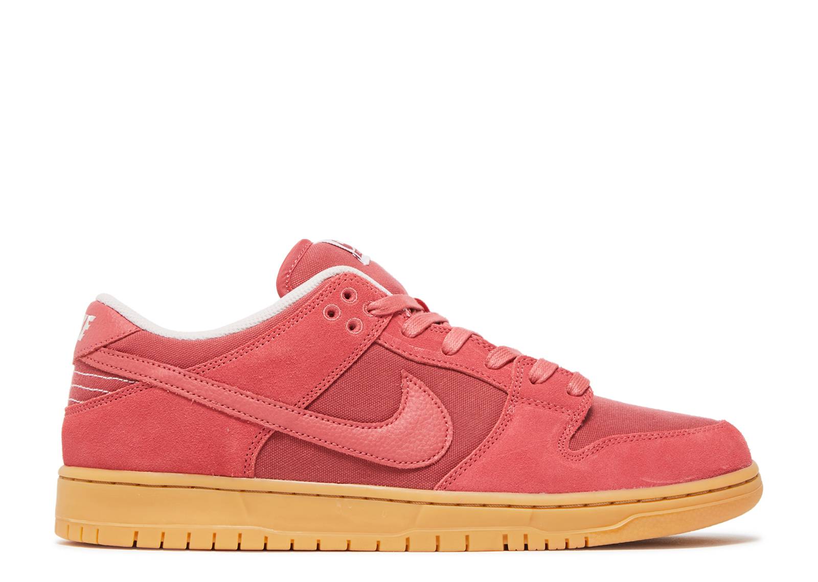 Nike Dunk Low SB Adobe sneaker in adobe red suede and canvas with gum sole, featuring white stitching and skate-inspired design.