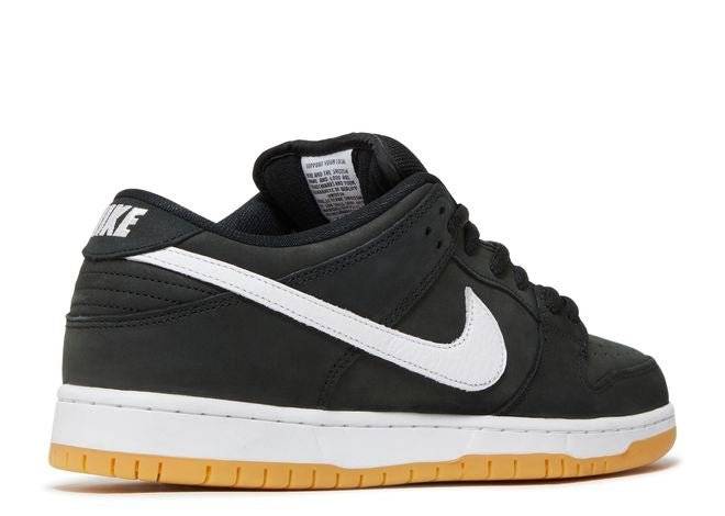 Rear side view of Nike SB Dunk Low Black Gum sneaker showcasing the white Nike logo on the heel and gum rubber outsole.