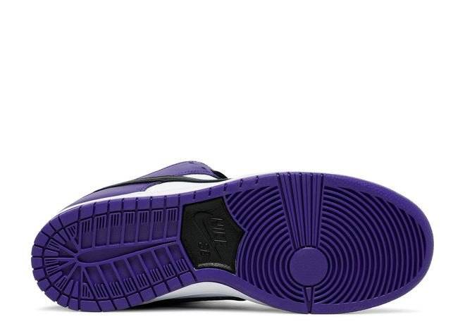 Outsole view of the Nike Dunk Low SB Court Purple sneaker featuring a vibrant purple rubber sole with black Nike branding. Durable and grippy design.